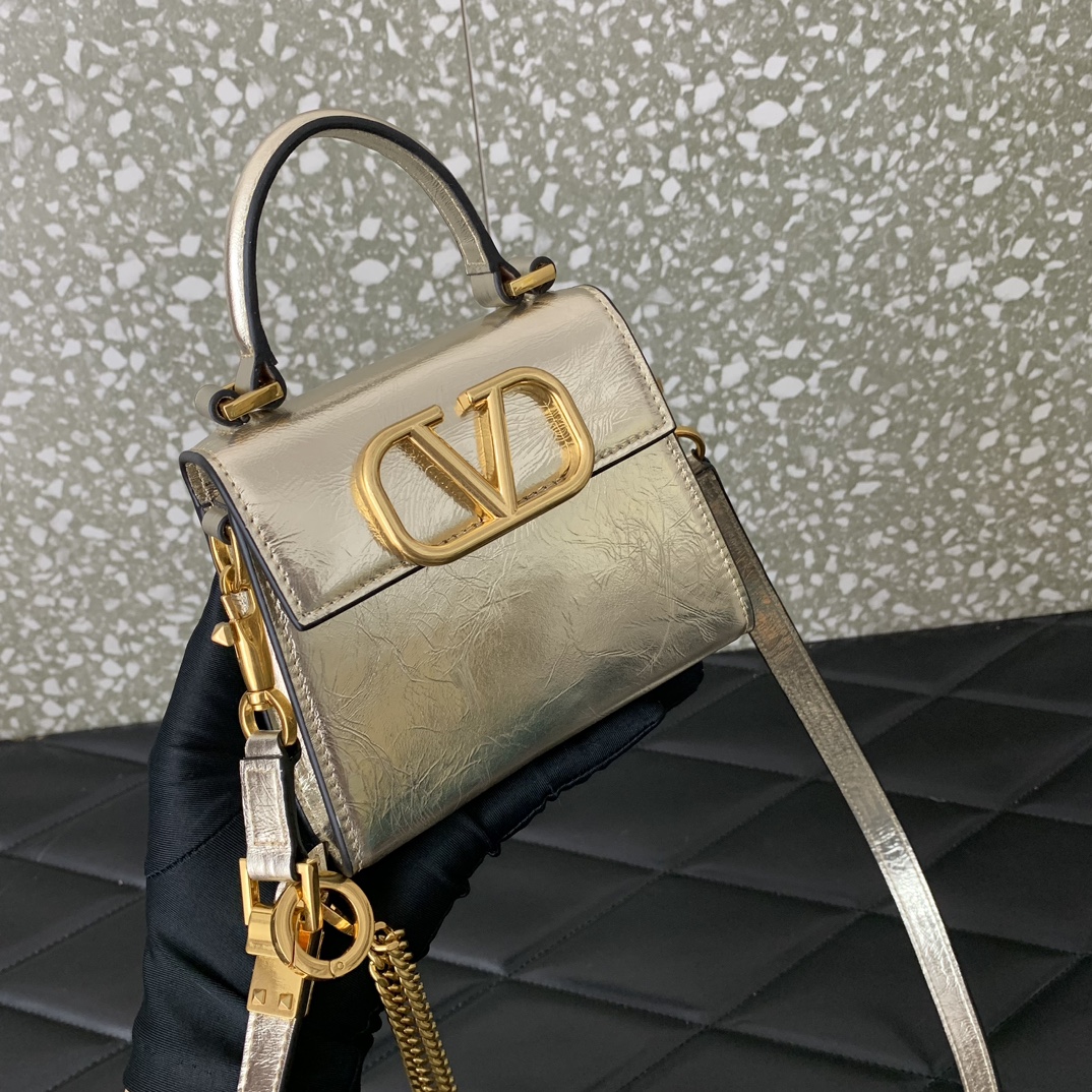 Valentino Garavani Vsling Micro Handbag in Gold Grainy Calfskin Leather 